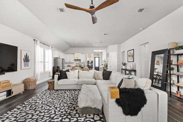 living room featuring ceiling fan, lofted ceiling, and dark hardwood / wood-style floors