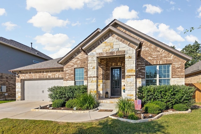 view of front facade featuring a garage and a front lawn