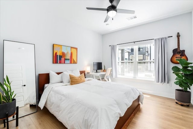 bedroom featuring ceiling fan and light hardwood / wood-style flooring