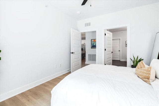 bedroom featuring ceiling fan and light hardwood / wood-style flooring