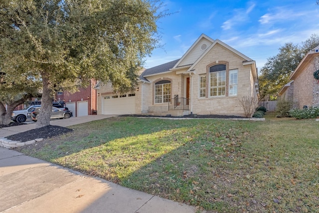 view of front of property featuring a garage and a front lawn