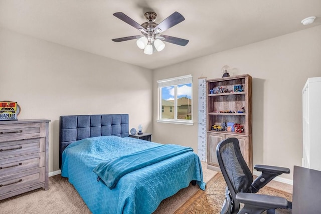 bedroom featuring light carpet and ceiling fan