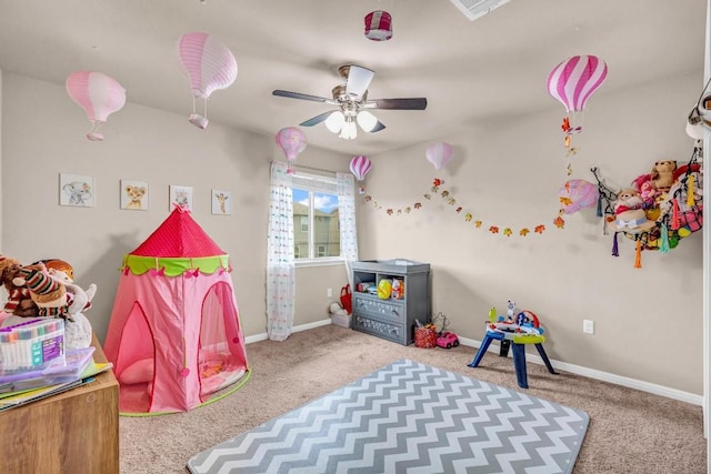 recreation room with carpet floors and ceiling fan