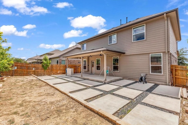 rear view of house featuring a patio