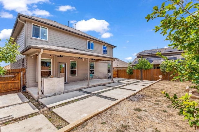 rear view of property featuring a patio area