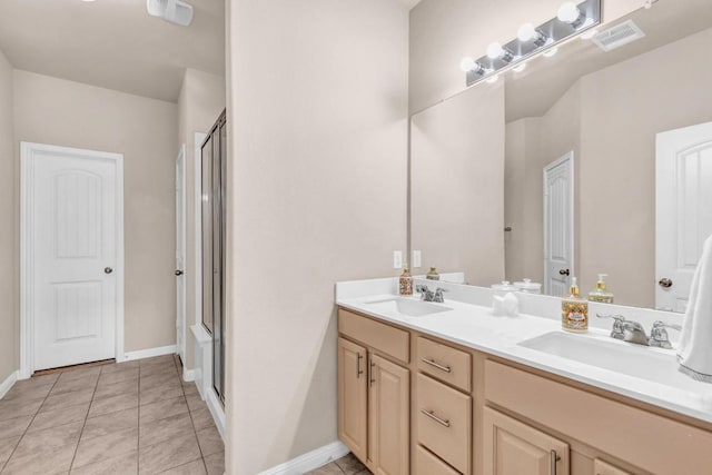 bathroom with vanity, tile patterned floors, and walk in shower