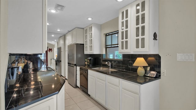 kitchen with dishwasher, decorative backsplash, white cabinetry, and sink