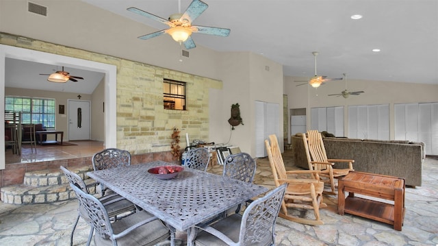 dining space featuring lofted ceiling