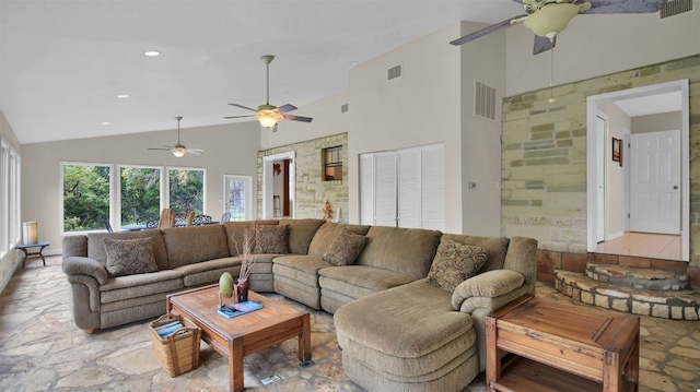 living room with high vaulted ceiling