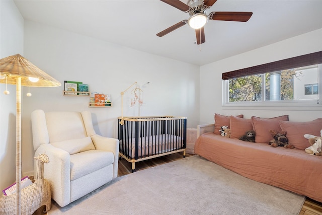 bedroom with ceiling fan and wood finished floors