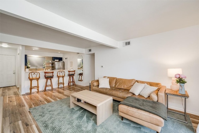 2208 Enfield Rd Unit 207, Austin, TX 78703 - living area featuring wood finished floors and beamed ceiling