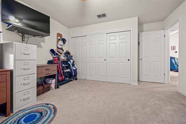 carpeted bedroom with a closet