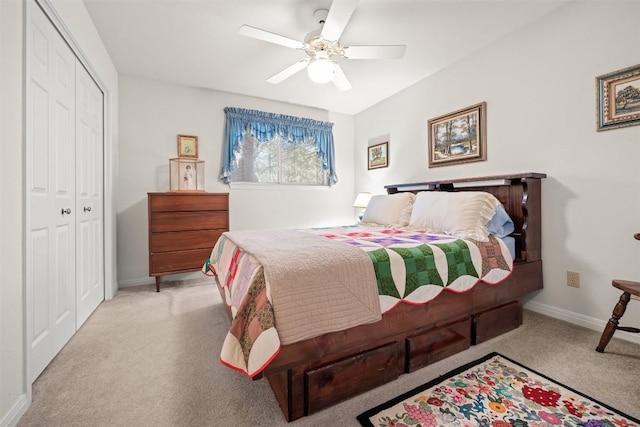 bedroom featuring ceiling fan, light carpet, and a closet