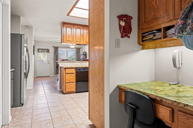 kitchen featuring dishwasher, stainless steel fridge with ice dispenser, kitchen peninsula, and light tile patterned floors