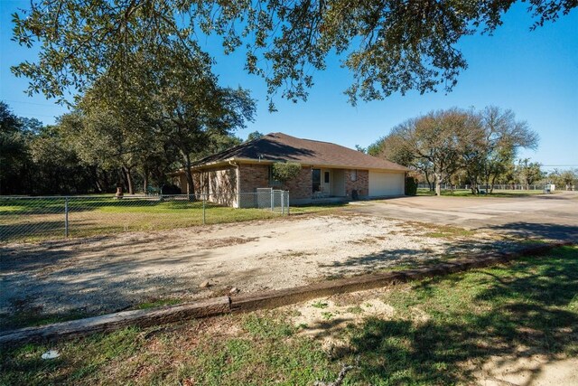 view of front of house with a front yard and a garage