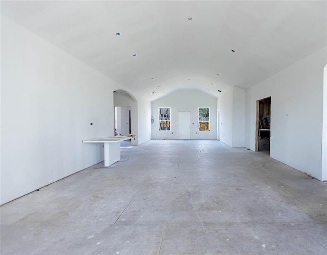 empty room with vaulted ceiling