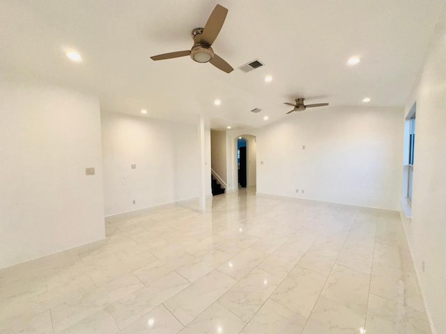 spare room with ceiling fan