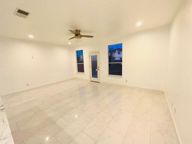 empty room featuring ceiling fan