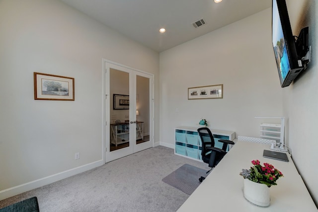 office space featuring french doors, visible vents, carpet floors, and baseboards