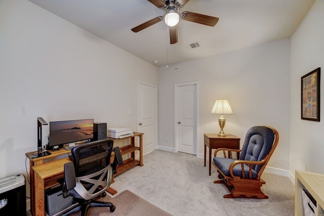 office space with visible vents, baseboards, ceiling fan, and carpet floors