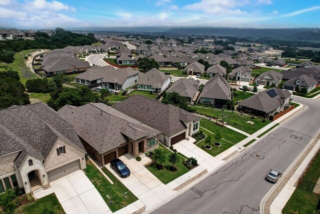 birds eye view of property with a residential view