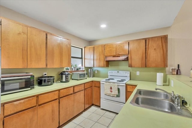 kitchen featuring white range with electric stovetop, light tile patterned flooring, and sink