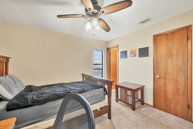 carpeted bedroom with ceiling fan