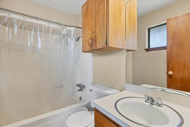 full bathroom featuring vanity, shower / tub combo, and toilet