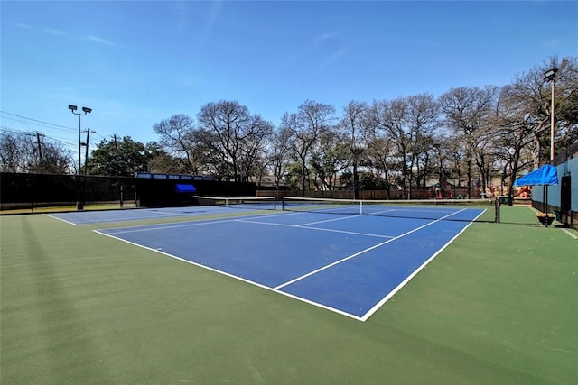 view of tennis court featuring basketball court