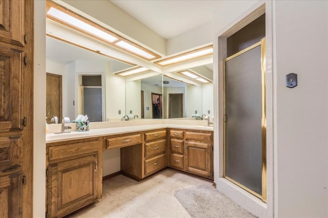 bathroom featuring vanity and an enclosed shower