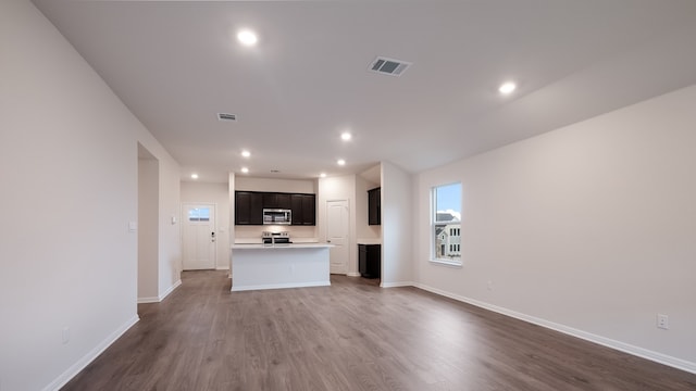 unfurnished living room with dark hardwood / wood-style flooring