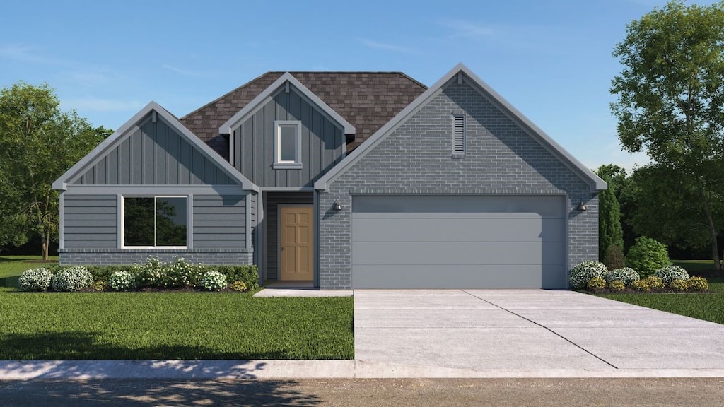 view of front facade with a garage and a front yard