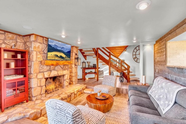 318 Coventry Rd, Spicewood, TX 78669 - living room with stairs, a fireplace, wood finished floors, and recessed lighting
