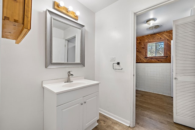 bathroom featuring vanity and hardwood / wood-style flooring