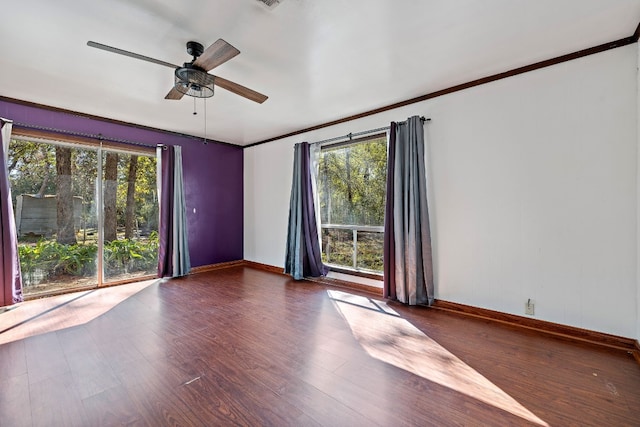 spare room with ceiling fan and dark wood-type flooring