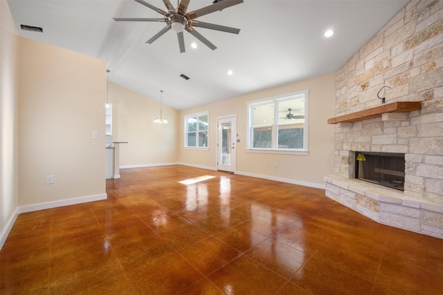 unfurnished living room featuring vaulted ceiling, a fireplace, and ceiling fan with notable chandelier