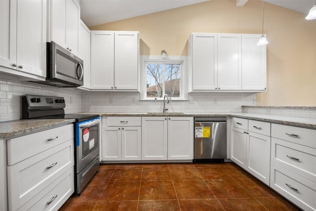 kitchen with white cabinets, lofted ceiling with beams, sink, and appliances with stainless steel finishes