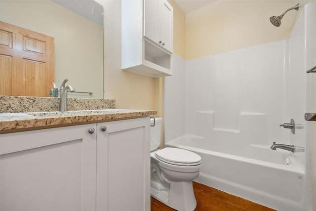 full bathroom featuring vanity, shower / bath combination, toilet, and hardwood / wood-style flooring