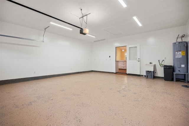 garage featuring electric water heater and a garage door opener