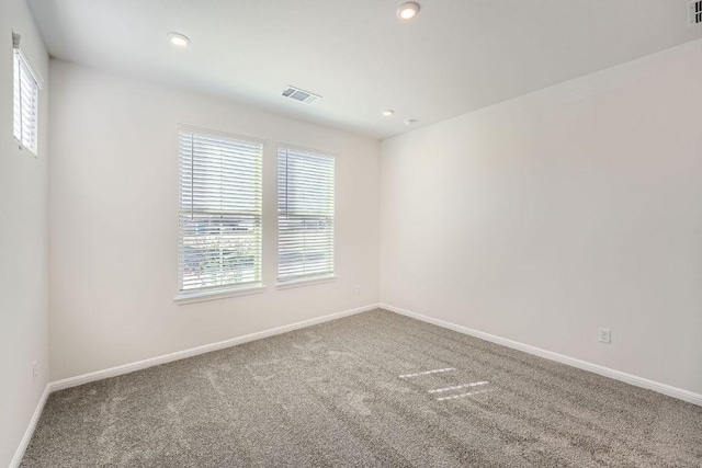 188 Weaver Ln, Bastrop, TX 78602 - unfurnished room featuring healthy amount of natural light, carpet flooring, and recessed lighting