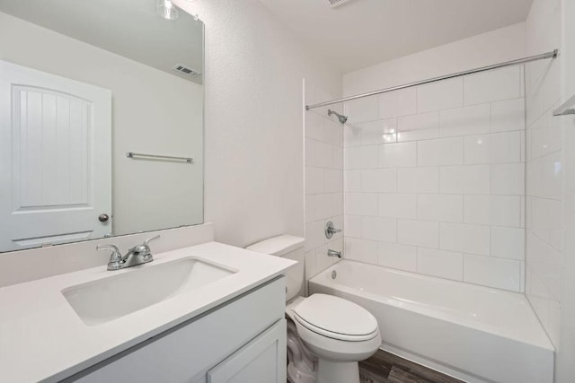188 Weaver Ln, Bastrop, TX 78602 - full bathroom featuring vanity, shower / bath combination, and wood finished floors