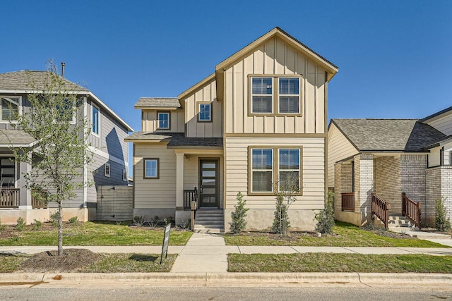 188 Weaver Ln, Bastrop, TX 78602 - view of front of home with board and batten siding and a front yard