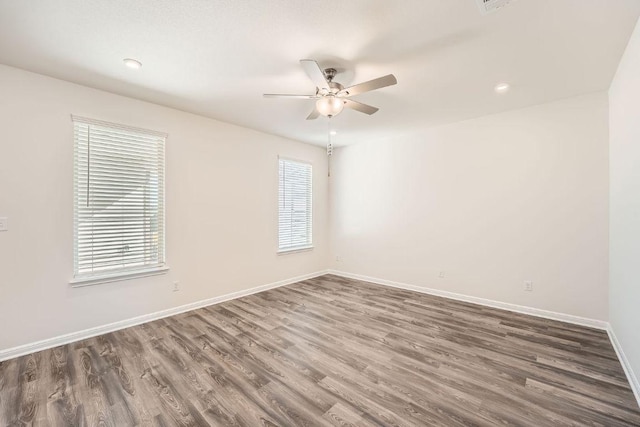 188 Weaver Ln, Bastrop, TX 78602 - spare room featuring wood finished floors, ceiling fan, and recessed lighting
