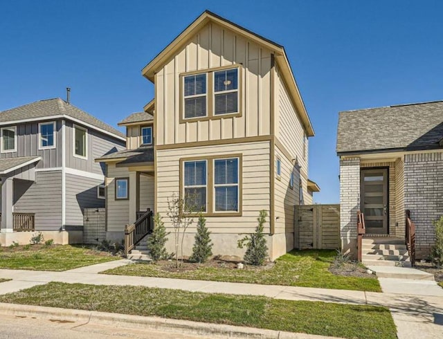 188 Weaver Ln, Bastrop, TX 78602 - view of front facade with board and batten siding and entry steps