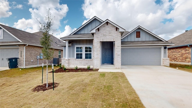 craftsman house featuring a garage, a front lawn, and central air condition unit