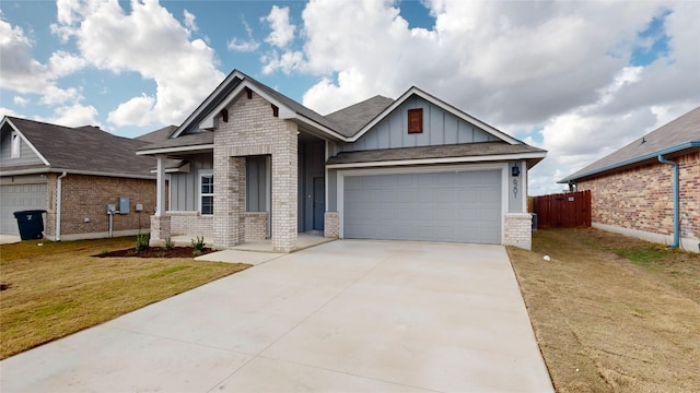 craftsman-style home with a garage and a front lawn