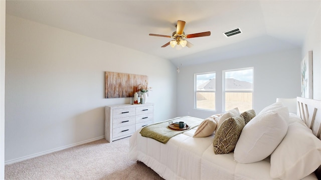 carpeted bedroom with ceiling fan and lofted ceiling