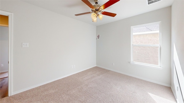 empty room featuring ceiling fan and carpet floors