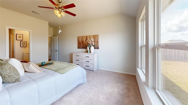 carpeted bedroom featuring connected bathroom, ceiling fan, and lofted ceiling