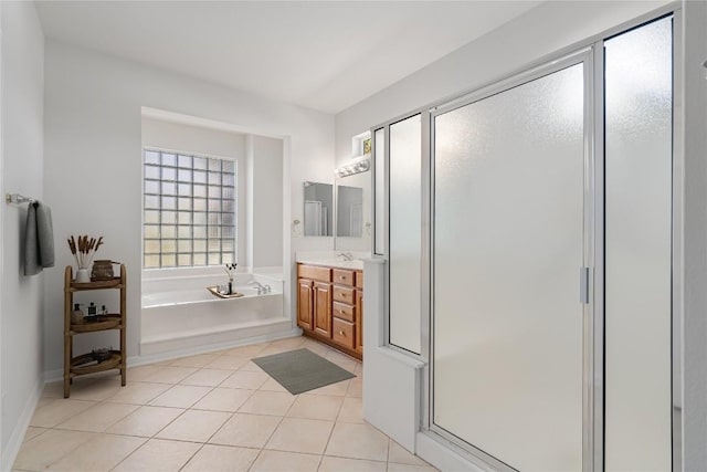 bathroom featuring tile patterned flooring, vanity, and independent shower and bath